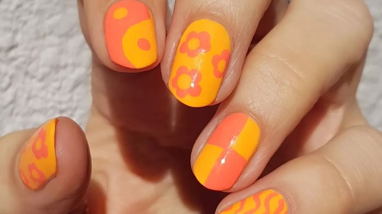 Orange and coral floral manicure