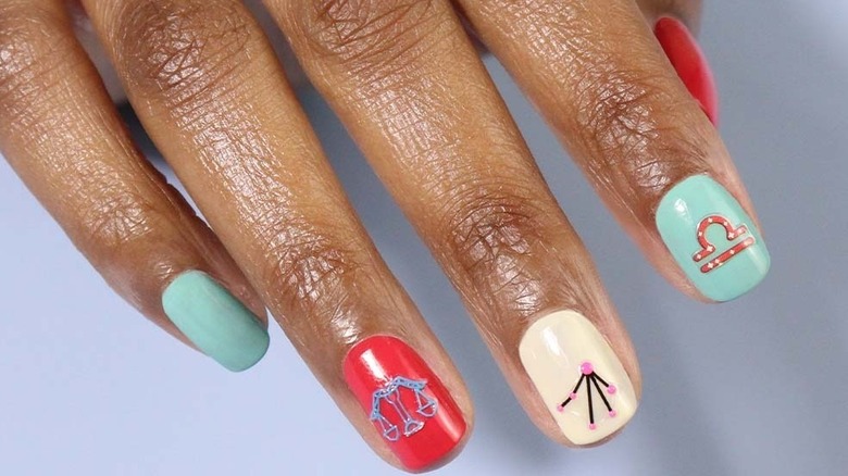 Zodiac symbols painted on nails