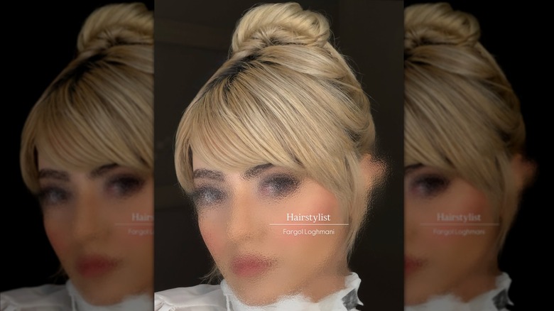 A woman with a slicked back updo.