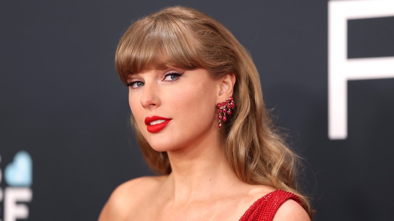 Taylor Swift smiles at the 2025 Grammys.