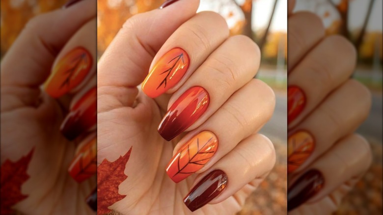 Square orange manicure with fall leaves designs