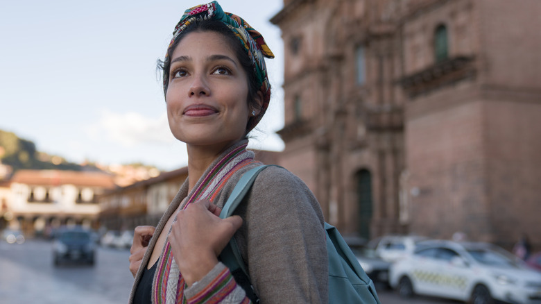 Woman walking through a city