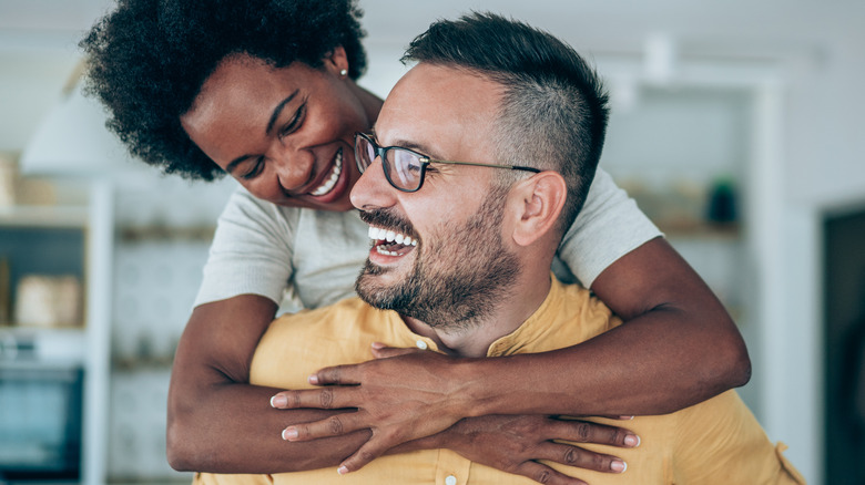 couple posing and laughing