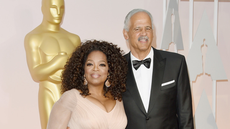 Oprah Winfrey and Stedman Graham  posing at the Oscars