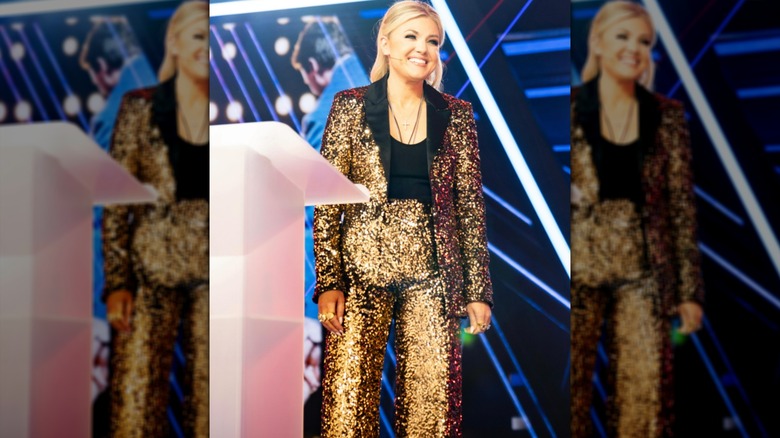 Erika Kirk speaks while at a podium on stage