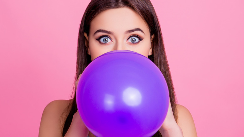 woman holding a balloon 