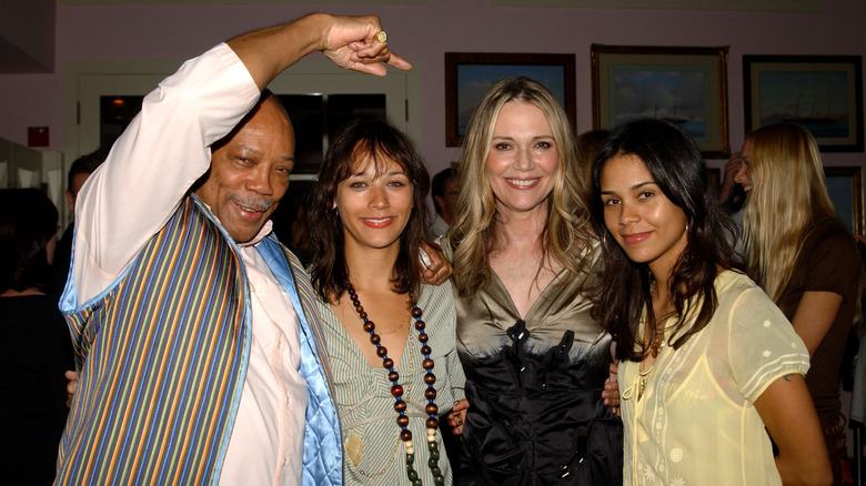 Quincy Jones, Rashida Jones, Peggy Lipton, and Kidada Jones posing together.