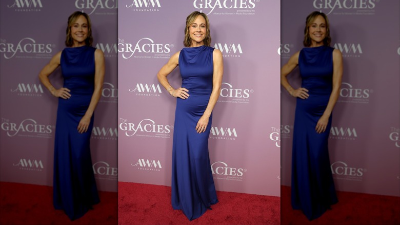 Nikki DeLoach pictured wearing a sapphire blue floor-length dress