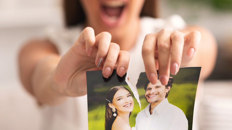 woman ripping photo