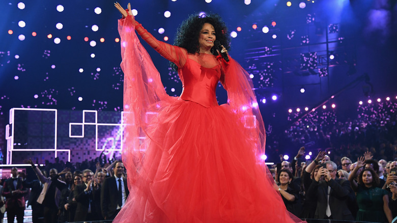 Diana Ross wears a red layered gown at the 2019 Grammy Awards