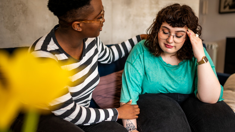 Woman comforting friend during discussion 