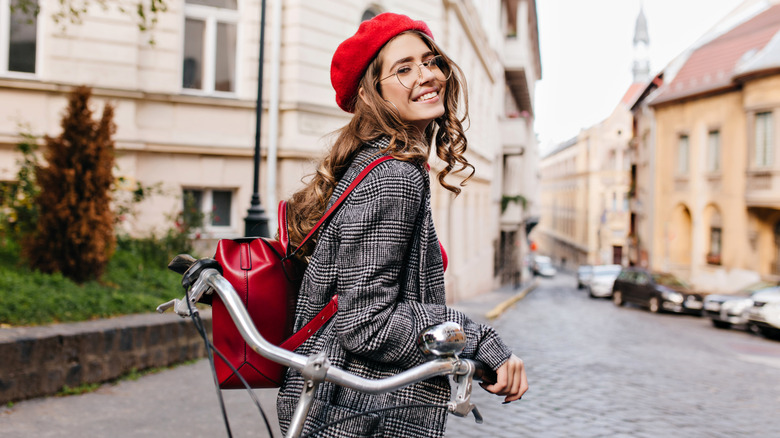 girl posing with a bike