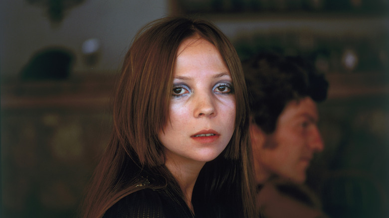 Model Penelope Tree at Capri. In the background can be seen the photographer Patrick Lichfield, Earl of Lichfield