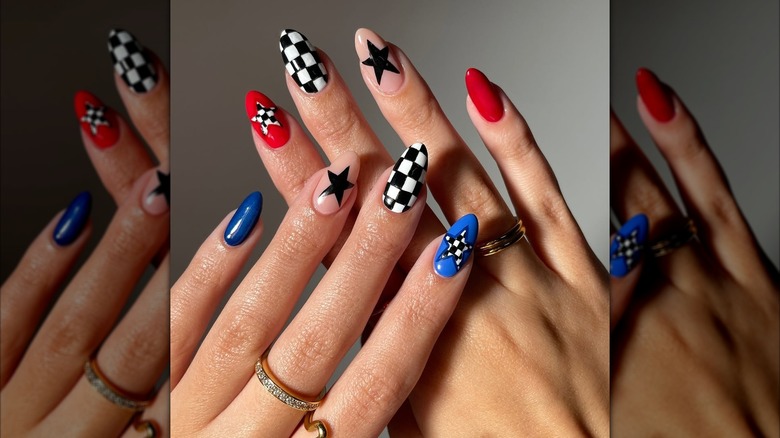 Nails with red, white, blue, and black stars and checkerboard designs.
