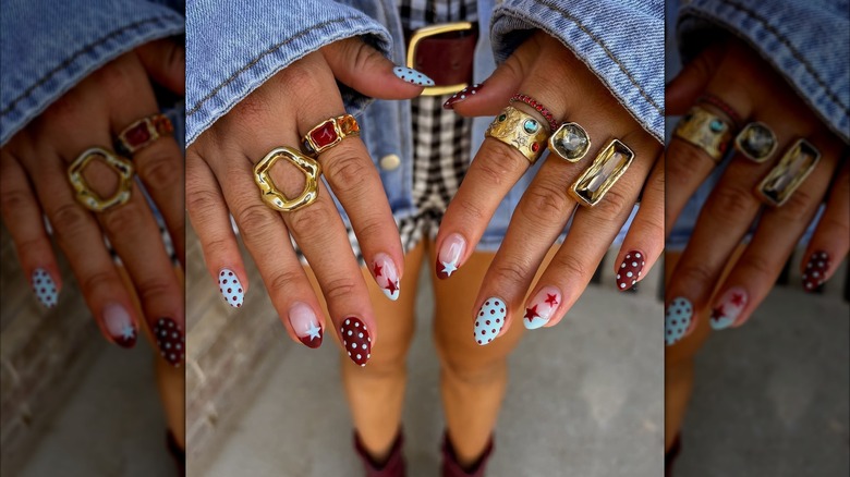 Red and blue nails with polka dots and stars.
