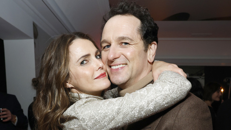 Keri Russell wraps her arms around partner Matthew Rhys in sweet press photo.