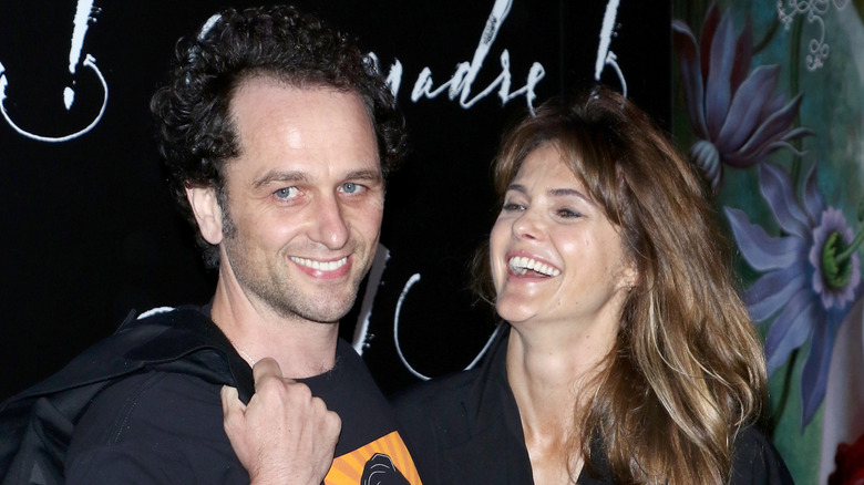 Matthew Rhys and Keri Russell are seen laughing while posing together on the red carpet