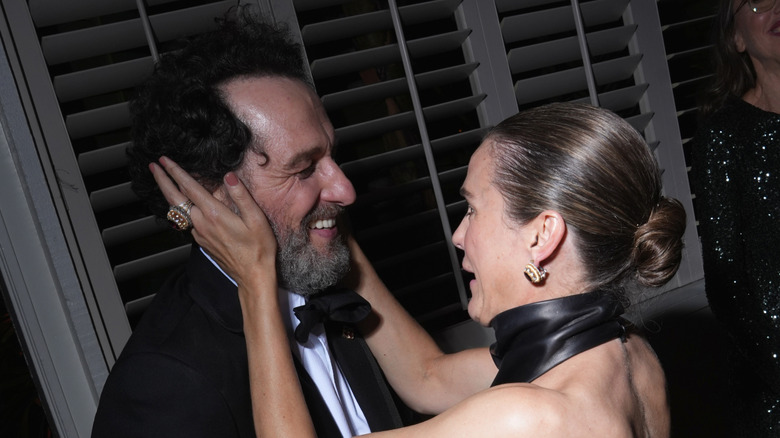 Matthew Rhys and Keri Russell are pictured celebrating backstage at the Emmys