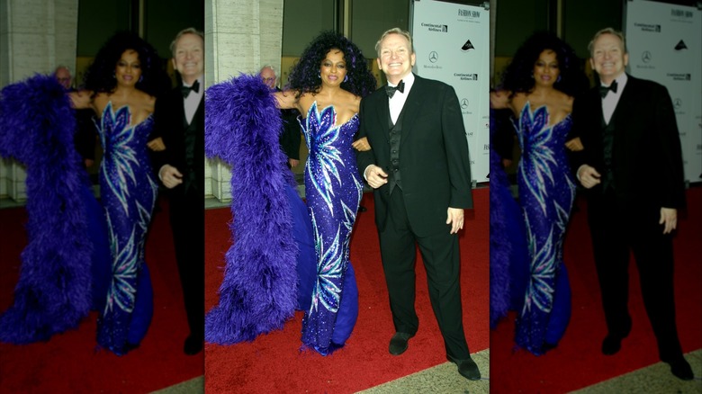 Diana Ross wearing a purple strapless dress and cape pictured with Bob Mackie