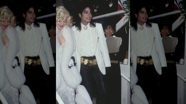 Madonna wears a white sequined Bob Mackie-designed dress and fur shawl next to Michael Jackson