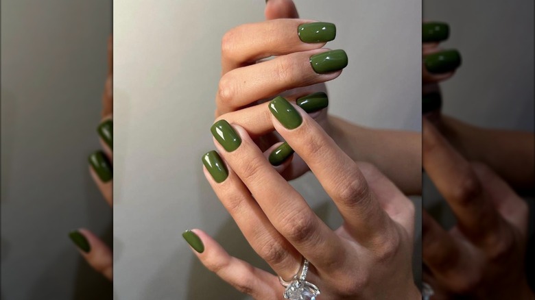 Short square manicure with forest green nail polish