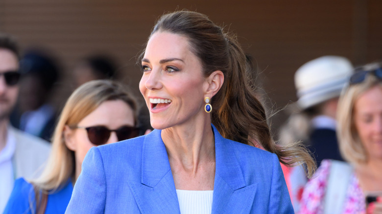 Kate Middleton wears a sky-blue jacket paired with a high ponytail while attending the 2026 Wimbledon Tennis Championship in London, England in July of 2026.
