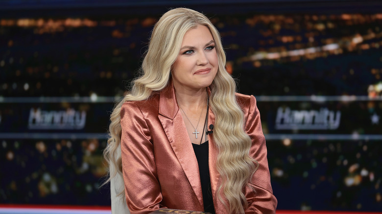 Erika Kirk on the Sean Hannity show swearing a copper blazer