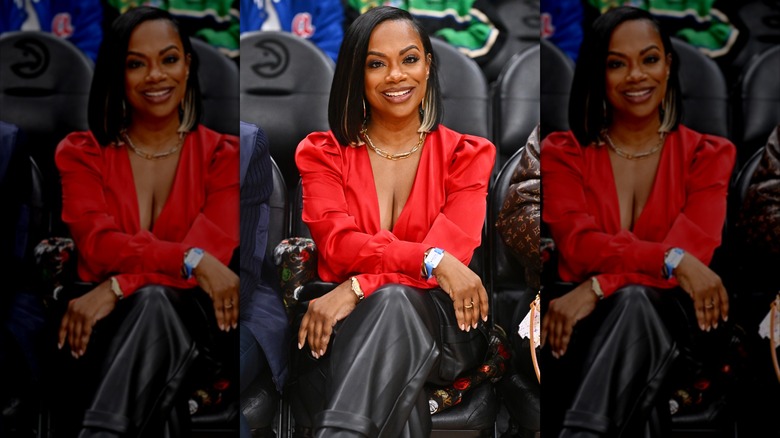 Kandi Burruss wearing a red top
