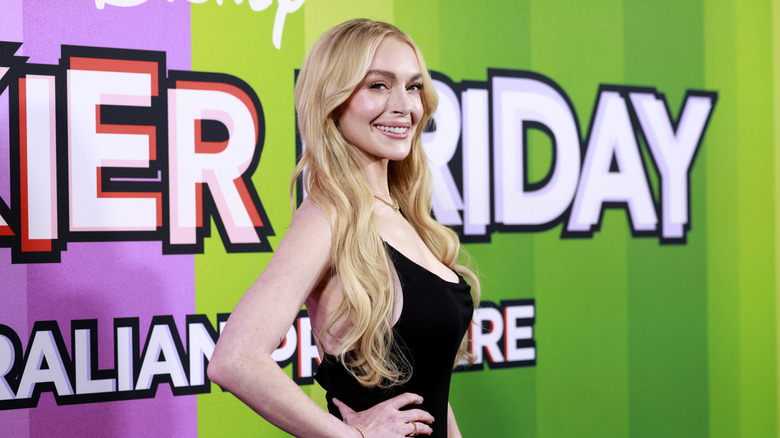 Lindsay Lohan smiles in a black dress