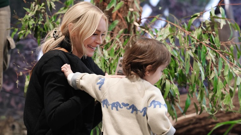 Lindsay Lohan smiles next to son Luai