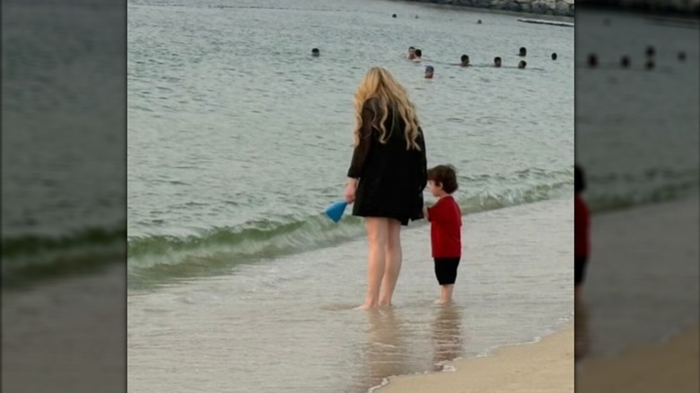 Lindsay Lohan holds son Luai's hand at the beach