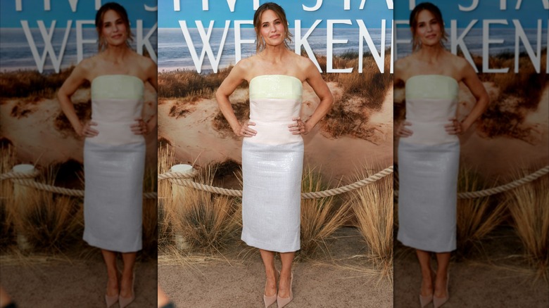 Jennifer Garner posing at an event in a strapless midi dress with pastel color blocks.