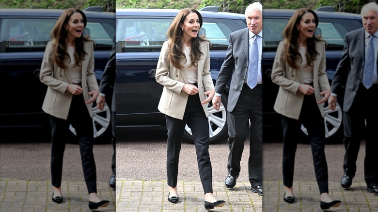 Kate Middleton wearing a tan blazer and black pants