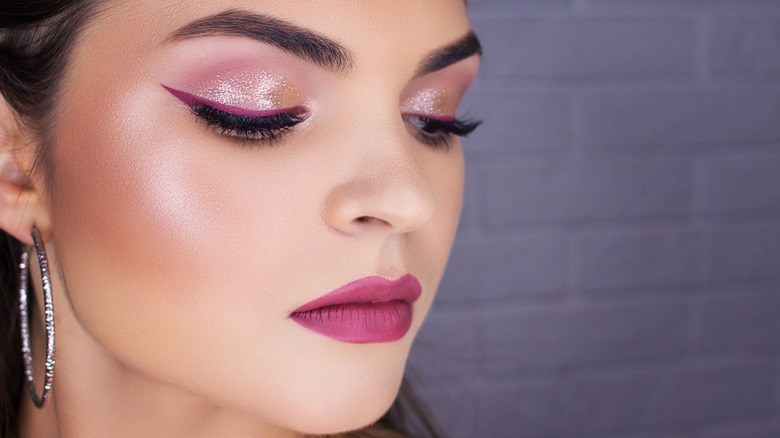 woman with bright pink eyeliner