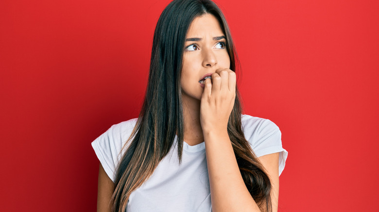 woman biting nails