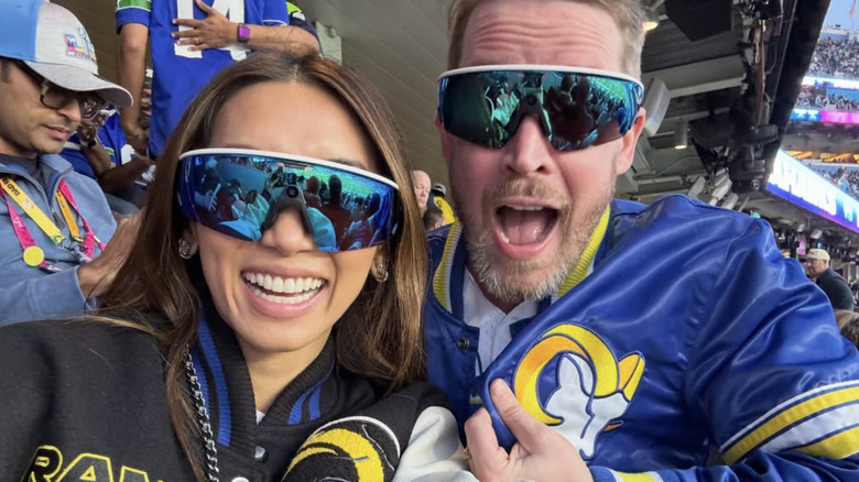 Brenda Song and Macaulay Culkin wearing matching Oakley Meta Sunglasses at the 2026 Super Bowl