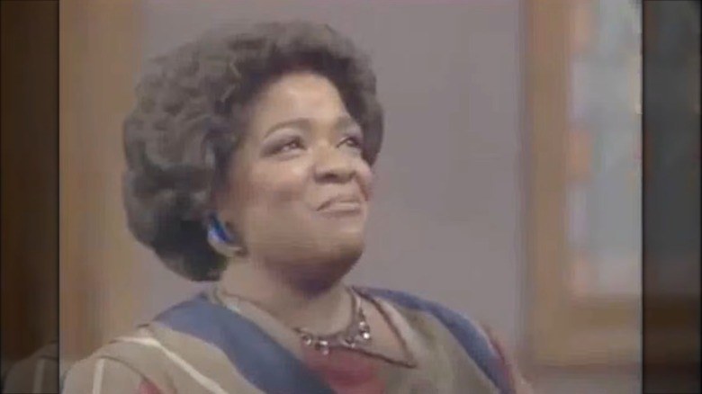Nell Carter wearing a striped blouse