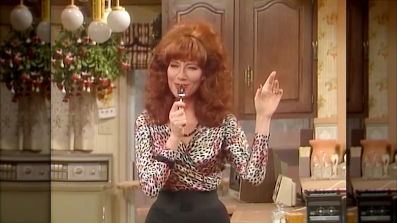 Katey Sagal wearing a leopard-print blouse with a voluminous ginger bouffant