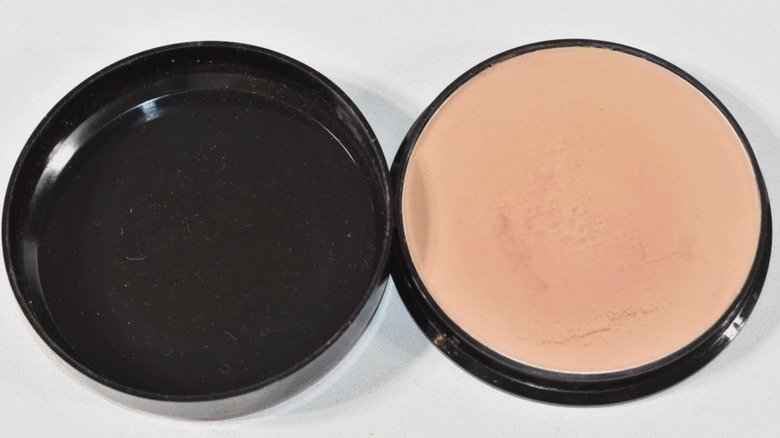 A max factor pancake foundation in TRUE BEIGE placed on a white background