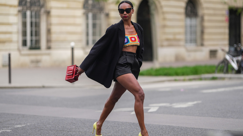 Woman carries red purse in Paris 