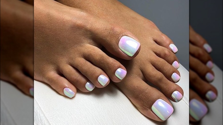A pedicure with iridescent pearlescent nail polish