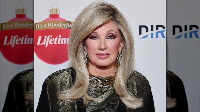Morgan Fairchild at an event in 2023 with a smooth blowout and side-swept bangs.