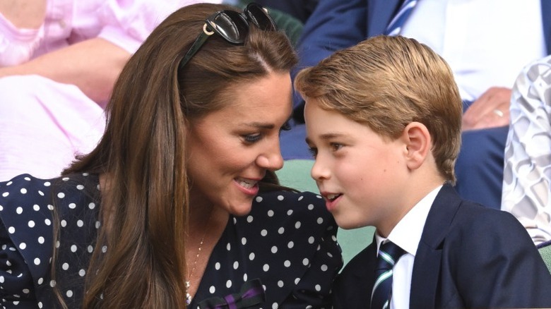 Kate Middleton and Prince George have a close conversation in the royal box at Wimbledon