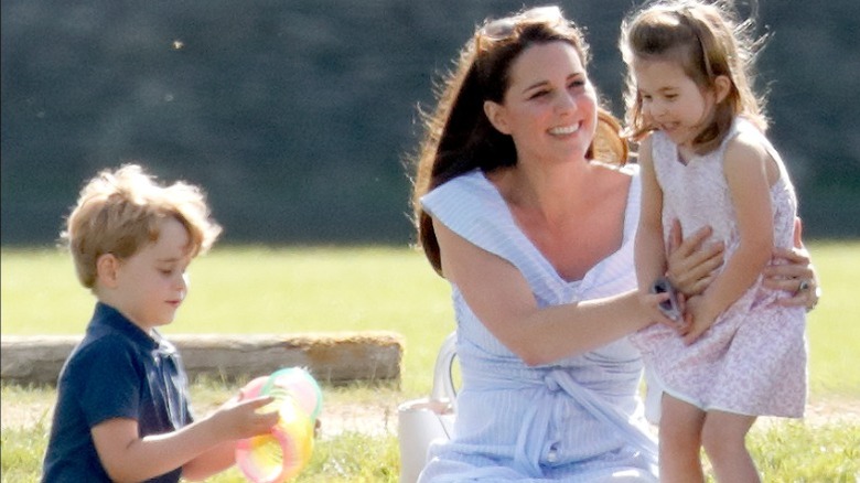 Kate Middleton with Prince George and Princess Charlotte at a polo tournament