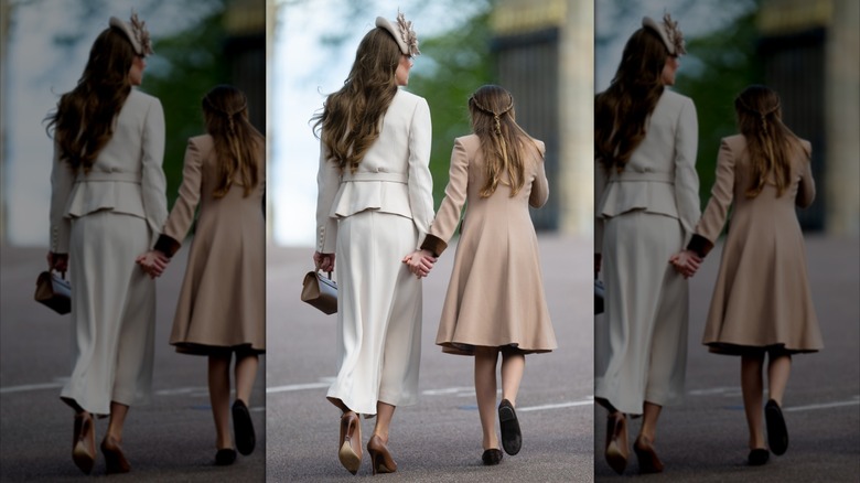 Kate Middleton and Princess Charlotte hold hands after the Easter Sunday church services in Windsor