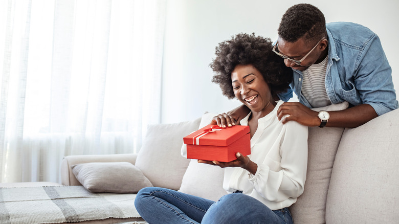 couple giving gifts to each other