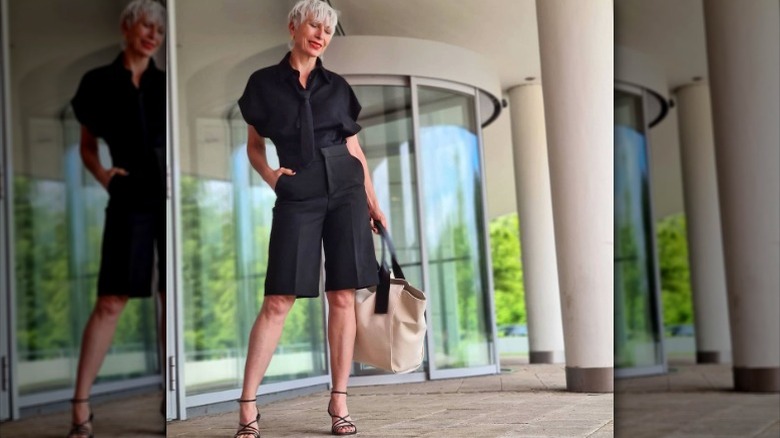 woman in black bermuda shorts