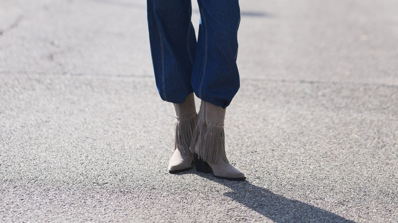Woman wearing fringed boots