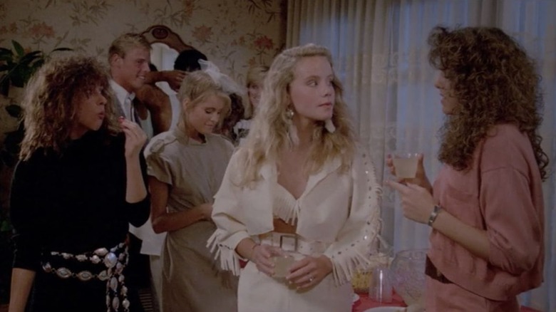 Amanda Peterson wearing a white fringe outfit in "Can't Buy Me Love."