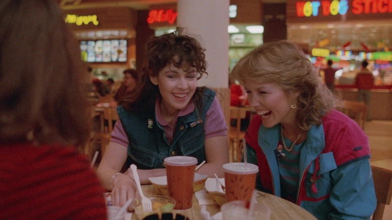 Deborah Foreman laughing at a mall food court table in "Valley Girl."